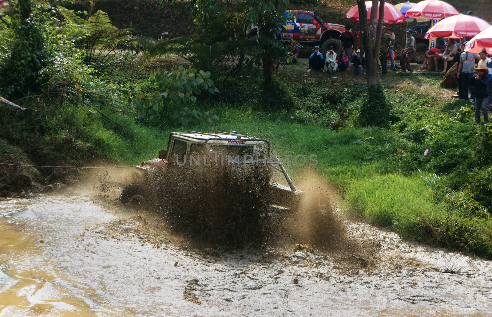 Racer offroad at terrain racing car competition by xuanhuongho