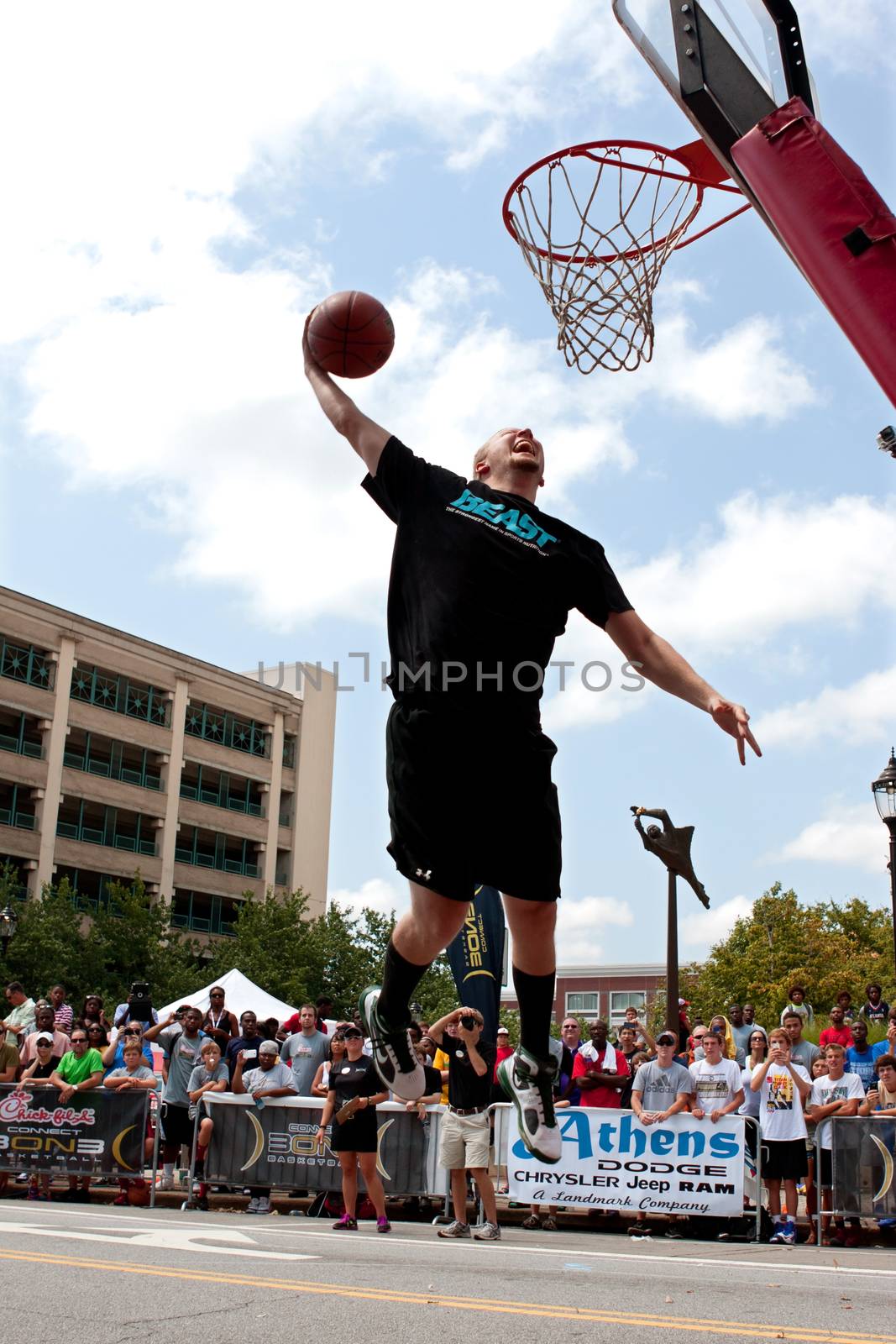 Man Leaps To Jam Basketball In Outdoor Slam Dunk Contest by BluIz60