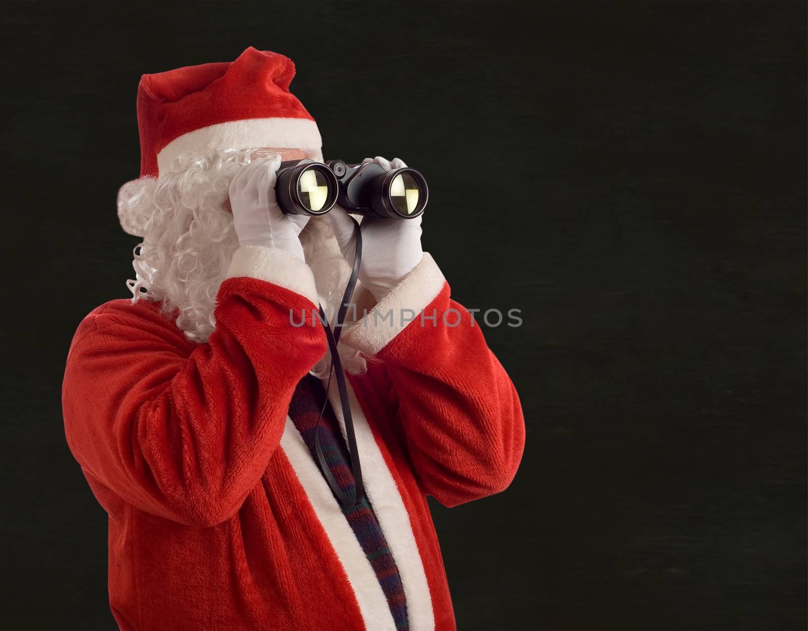 Father Christmas looking at the future business strategy blackboard background