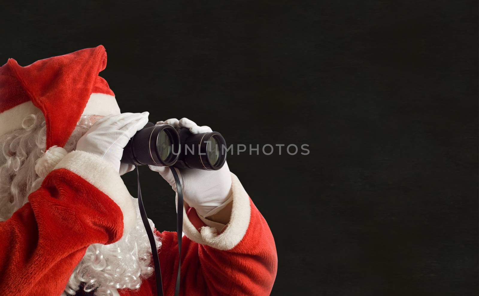 Father Christmas looking at the future business strategy blackboard background by alistaircotton