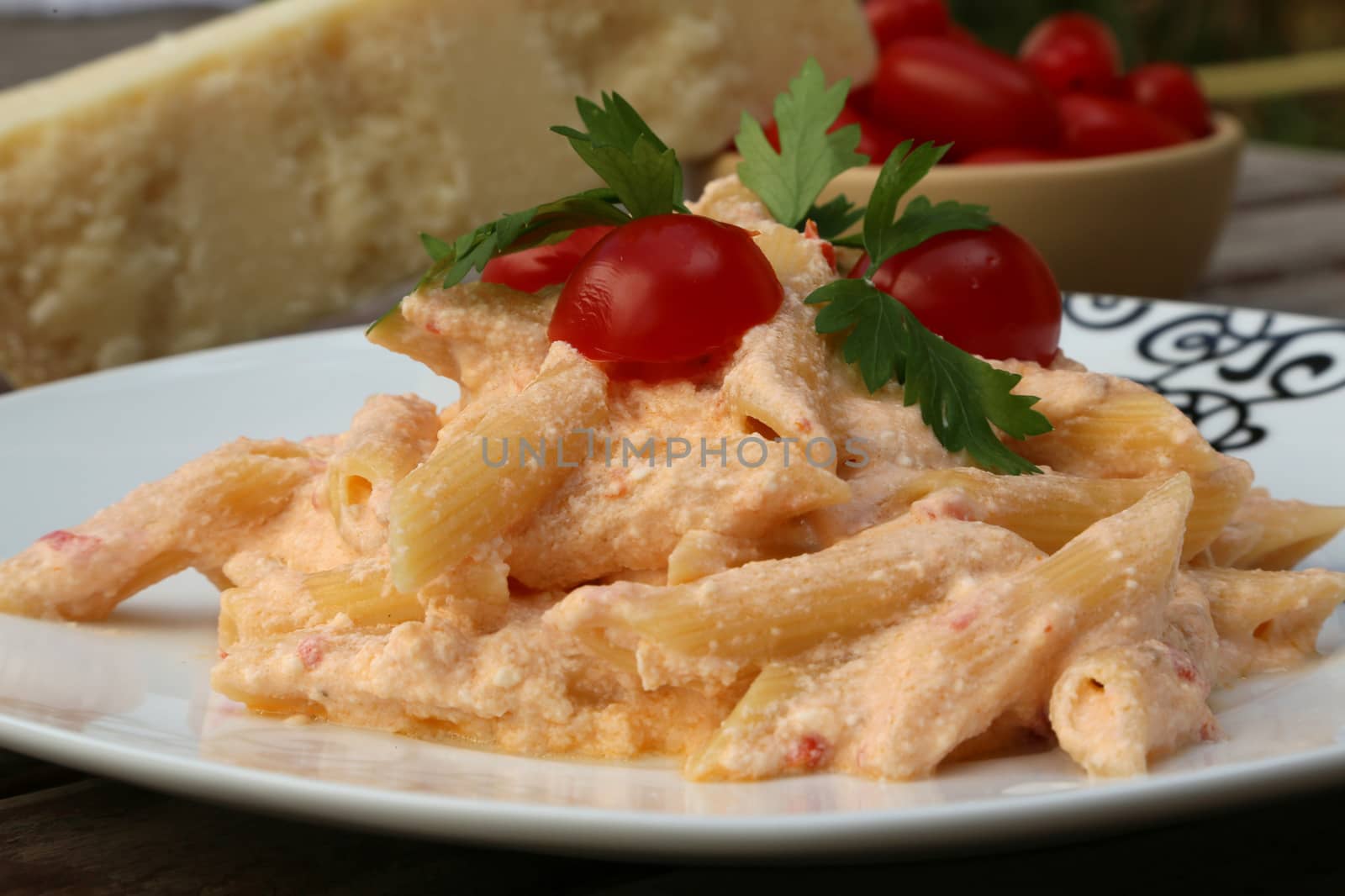 Italian pasta with ricotta cheese, parmesan, cherry tomatoes and parsley.