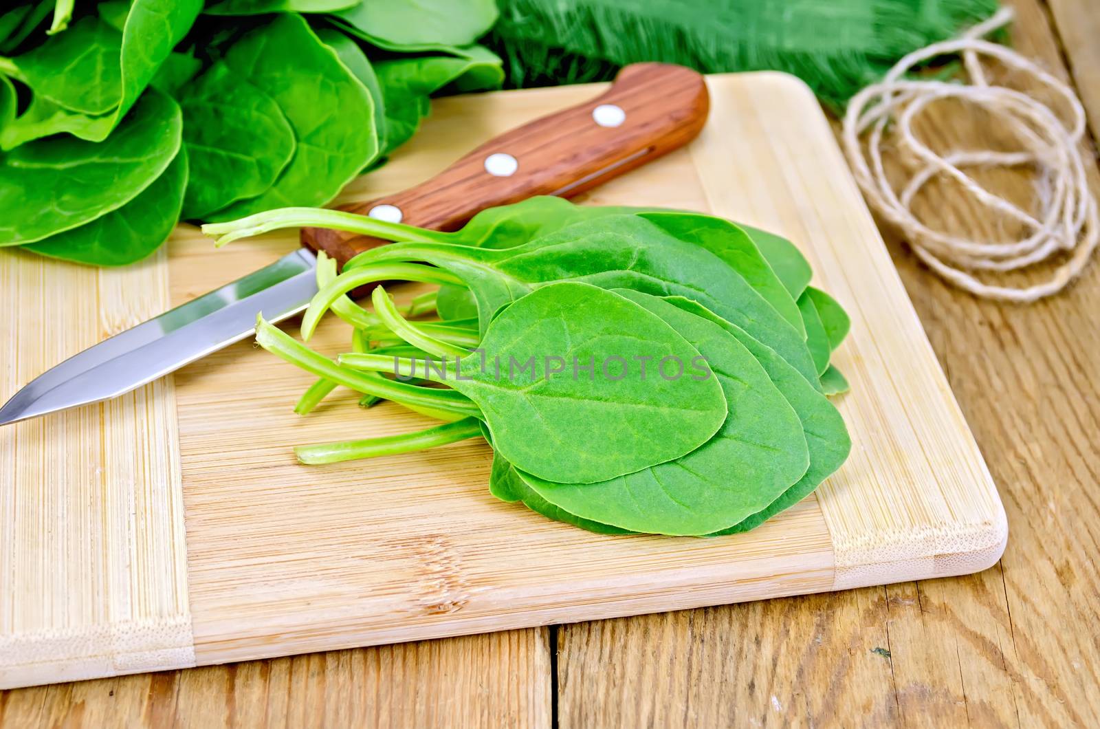 Spinach on the board with a knife by rezkrr