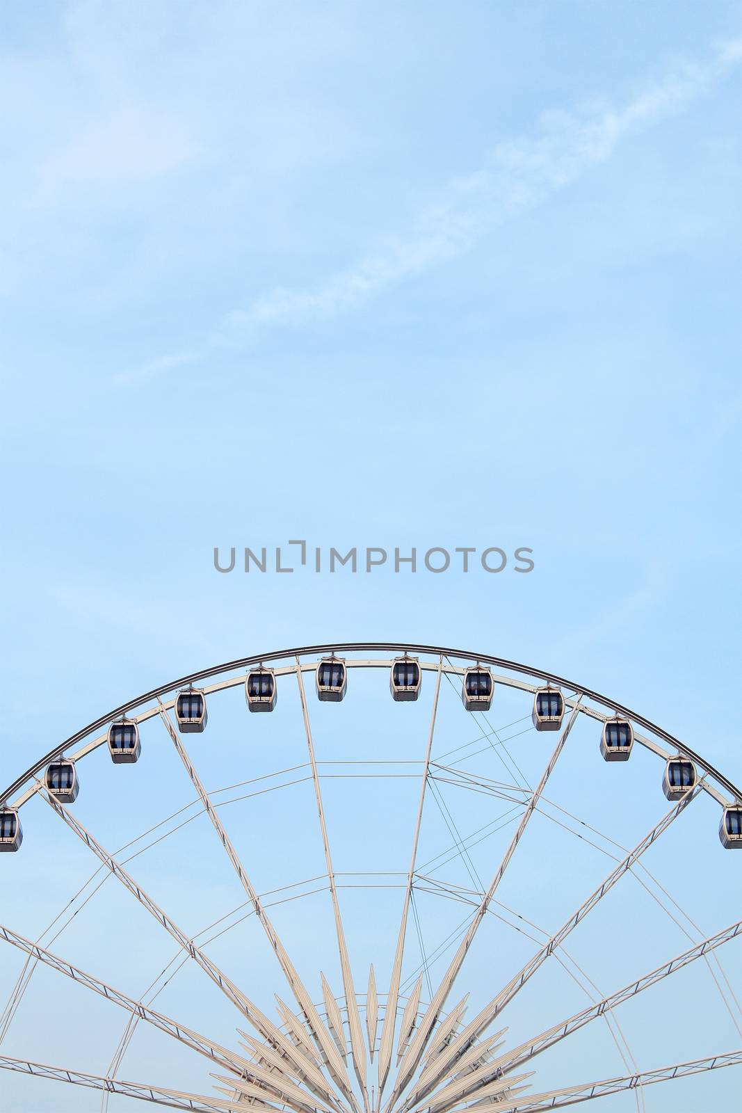 Ferris wheel with blue sky