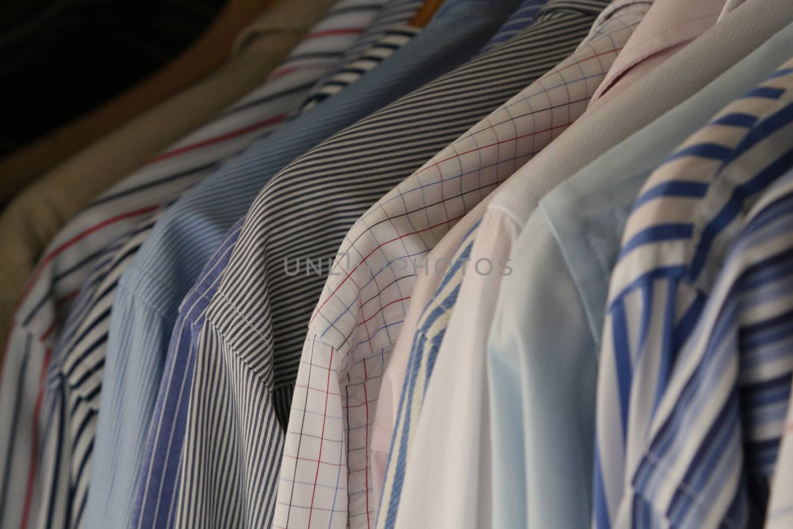 A row of hanging businessman's shirts