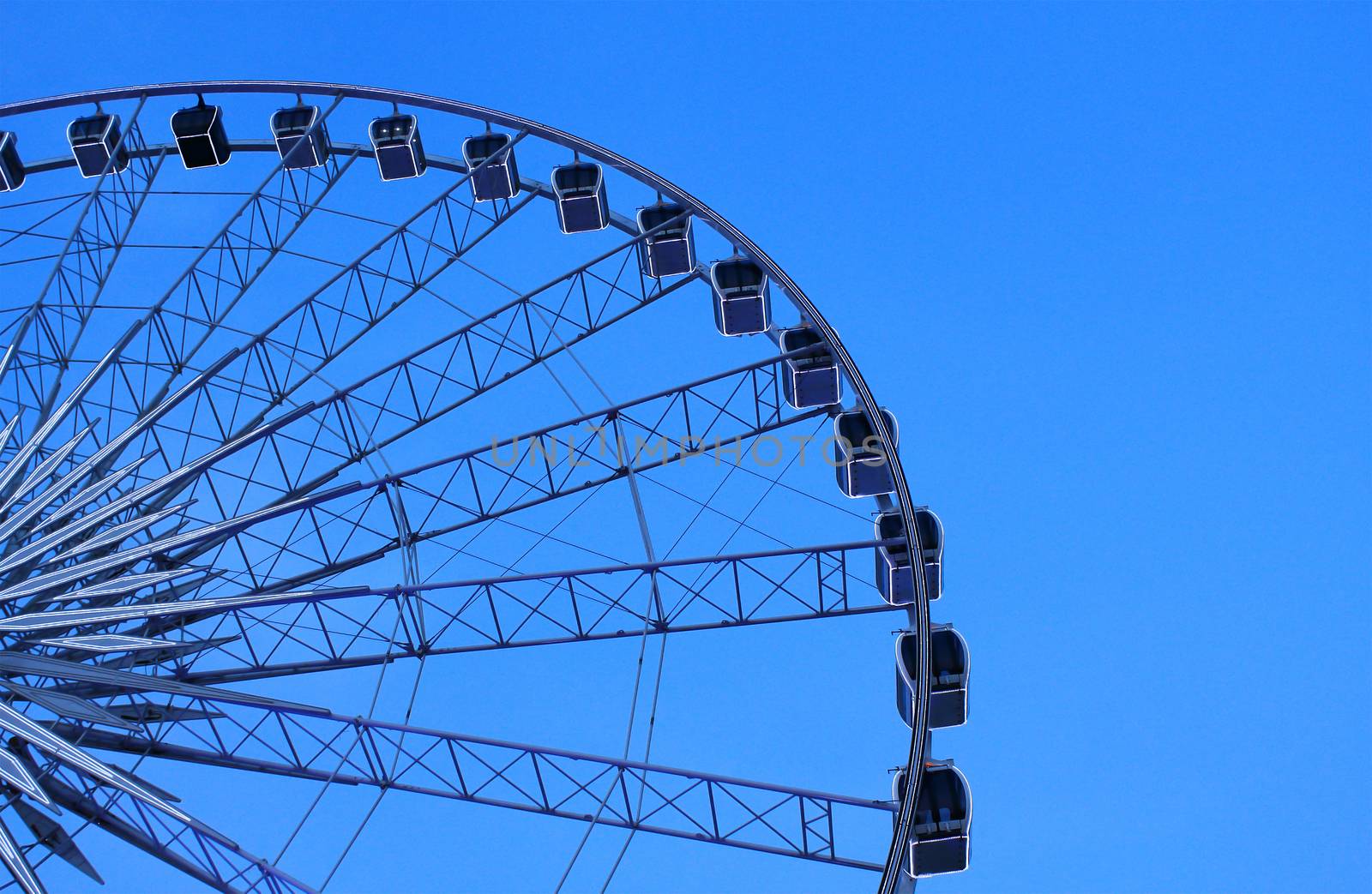 Ferris wheel with blue sky