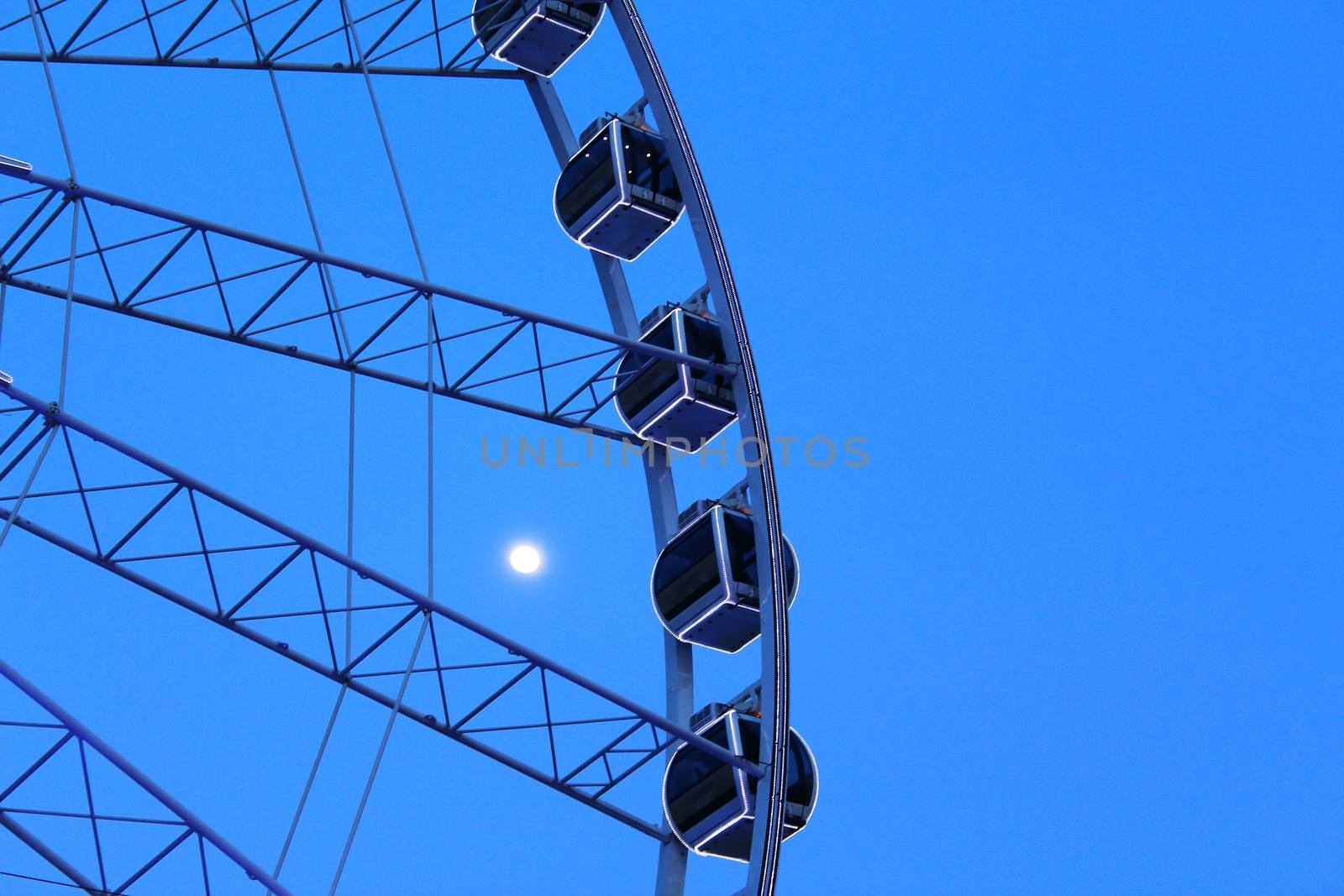 Ferris wheel with blue sky