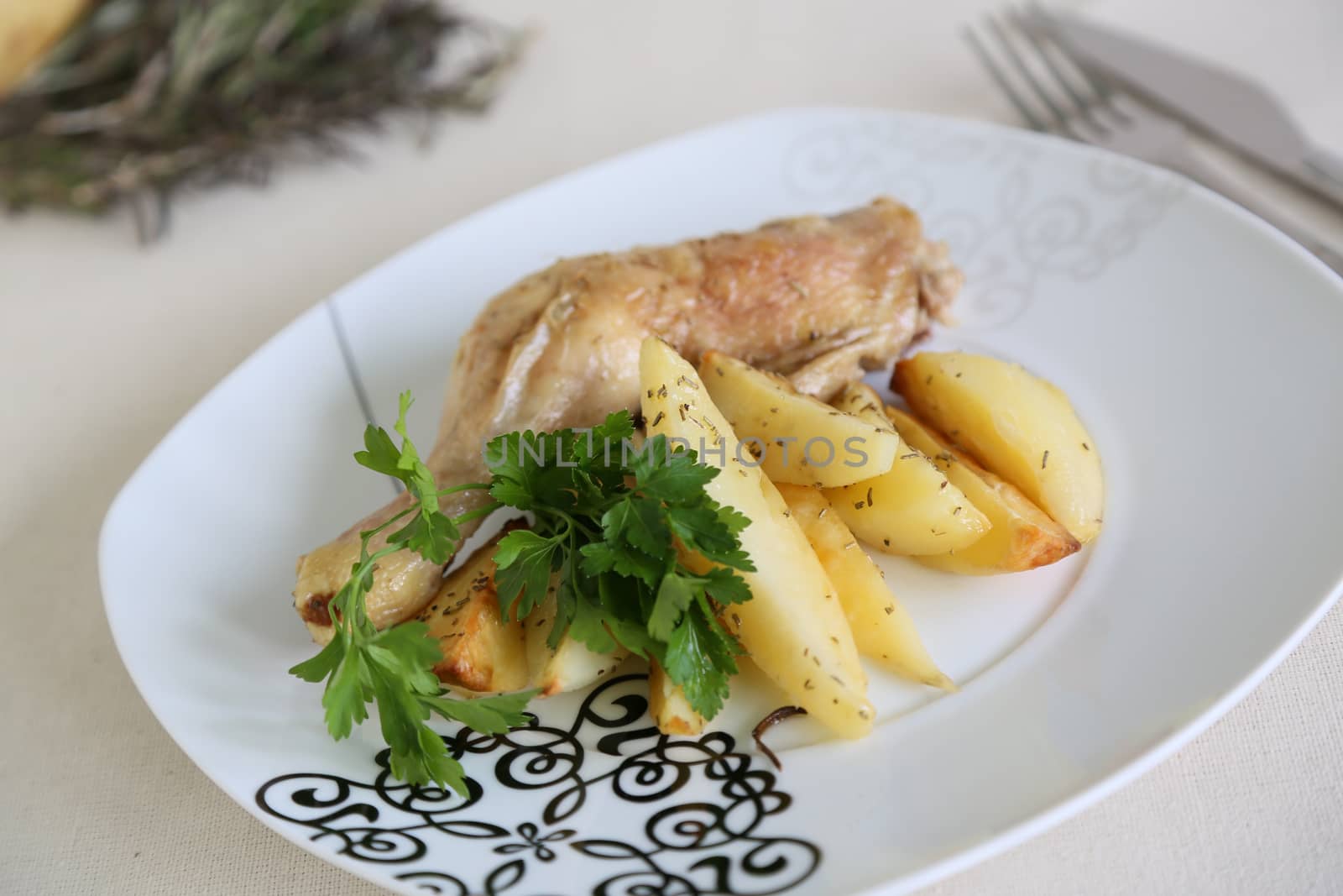 Chicken with potatoes and fresh parsley by tolikoff_photography