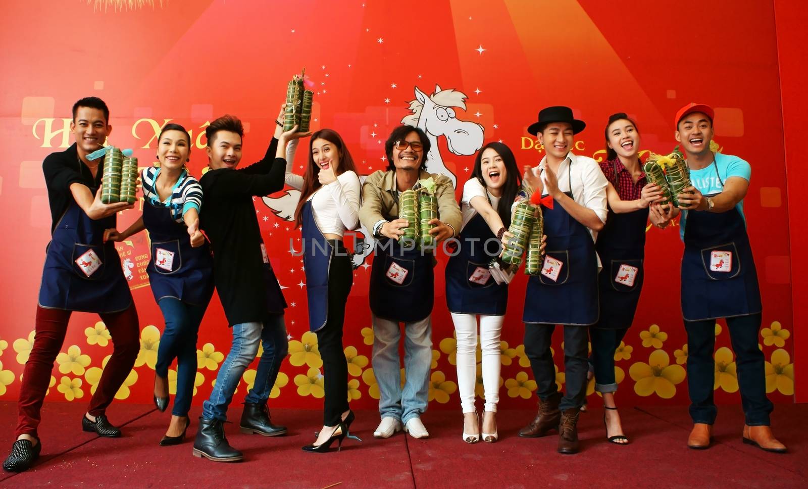 HO CHI MINH CITY, VIET NAM- JAN 15: Artist people in make cake competition, they doing traditional food - banh tet: famous food in Tet (Lunar New Year)- with  joyful and clever, Vietnam, Jan 15, 2013