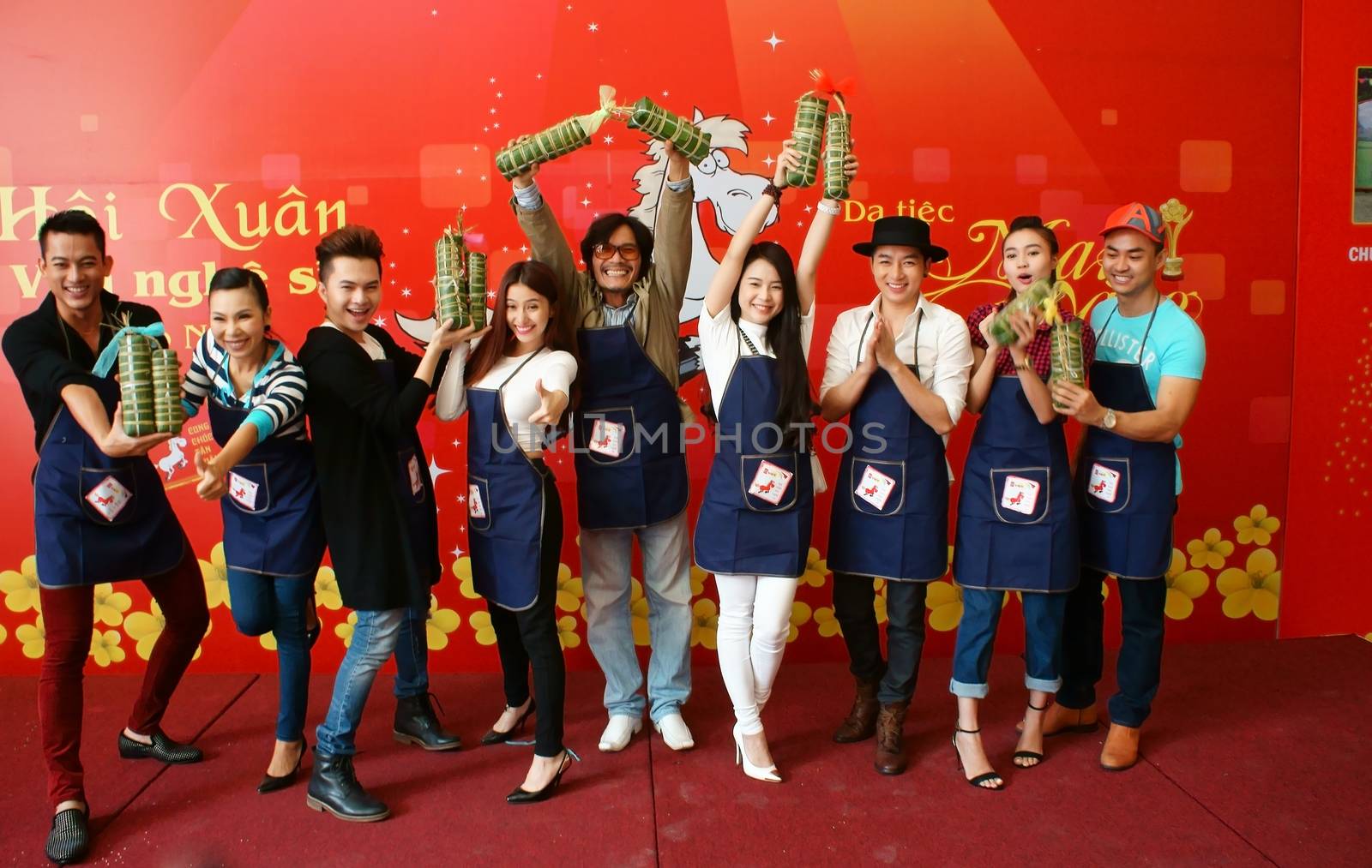 HO CHI MINH CITY, VIET NAM- JAN 15: Artist people in make cake competition, they doing traditional food - banh tet: famous food in Tet (Lunar New Year)- with  joyful and clever, Vietnam, Jan 15, 2013