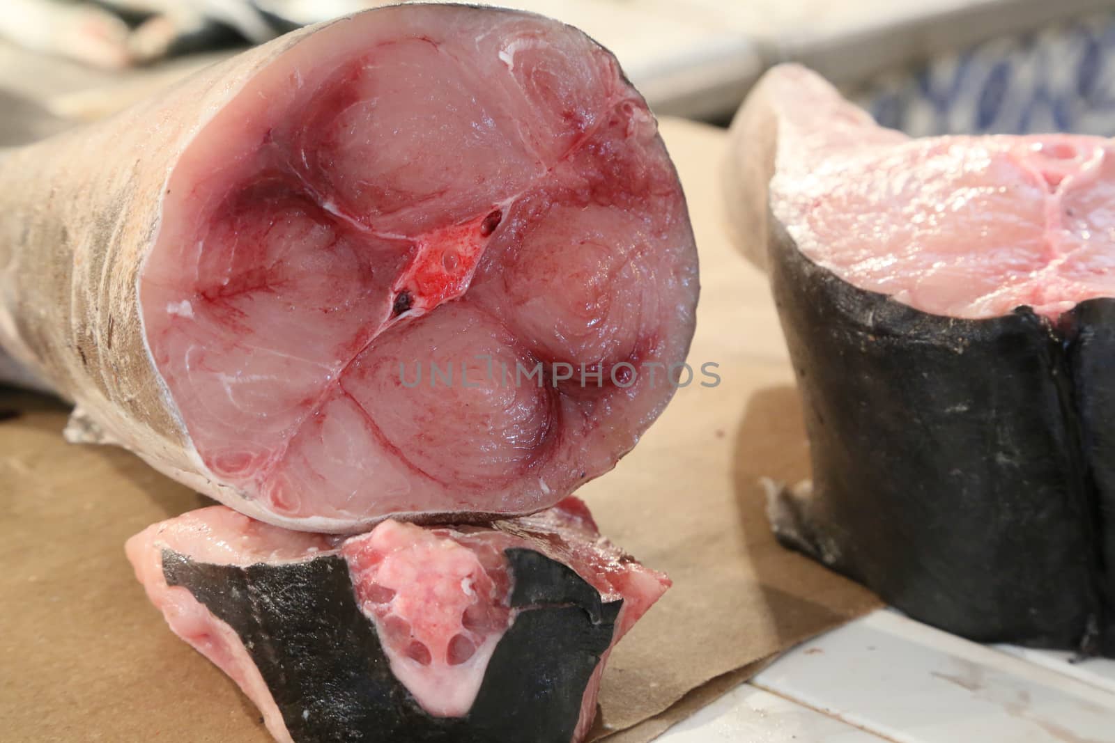 a big piece of swordfish sold at the fish market