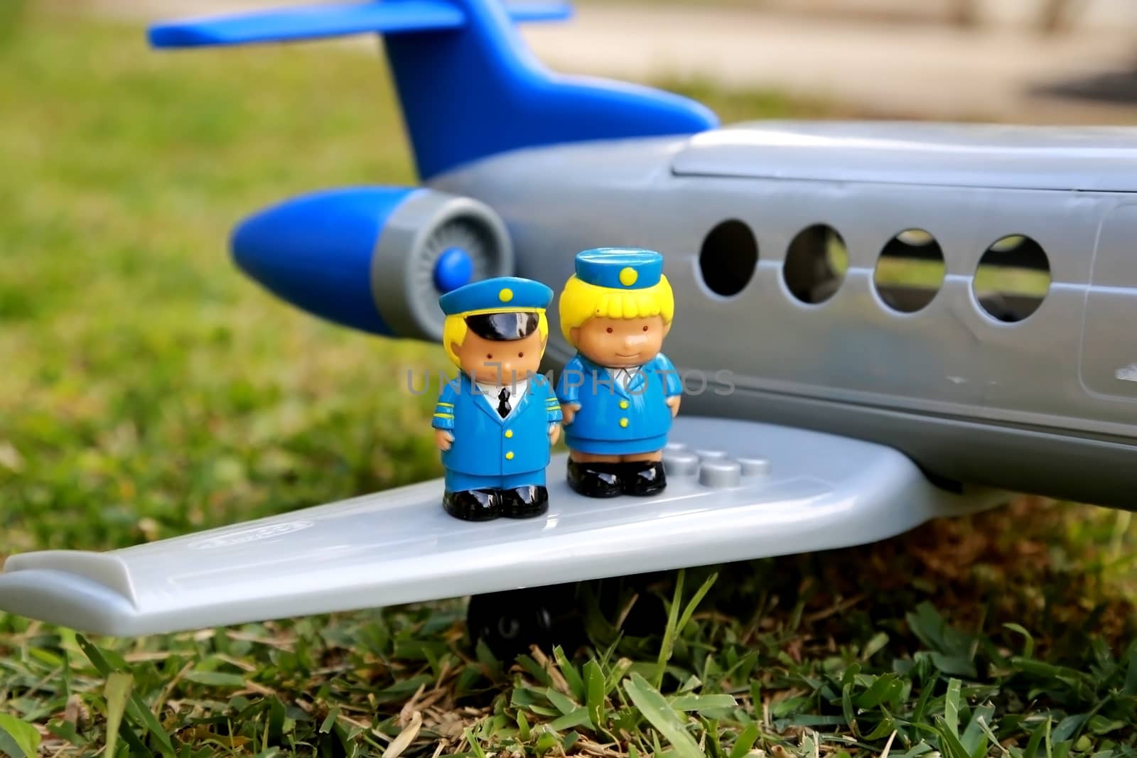 Pilot and stewardess on the wing of an aircraft