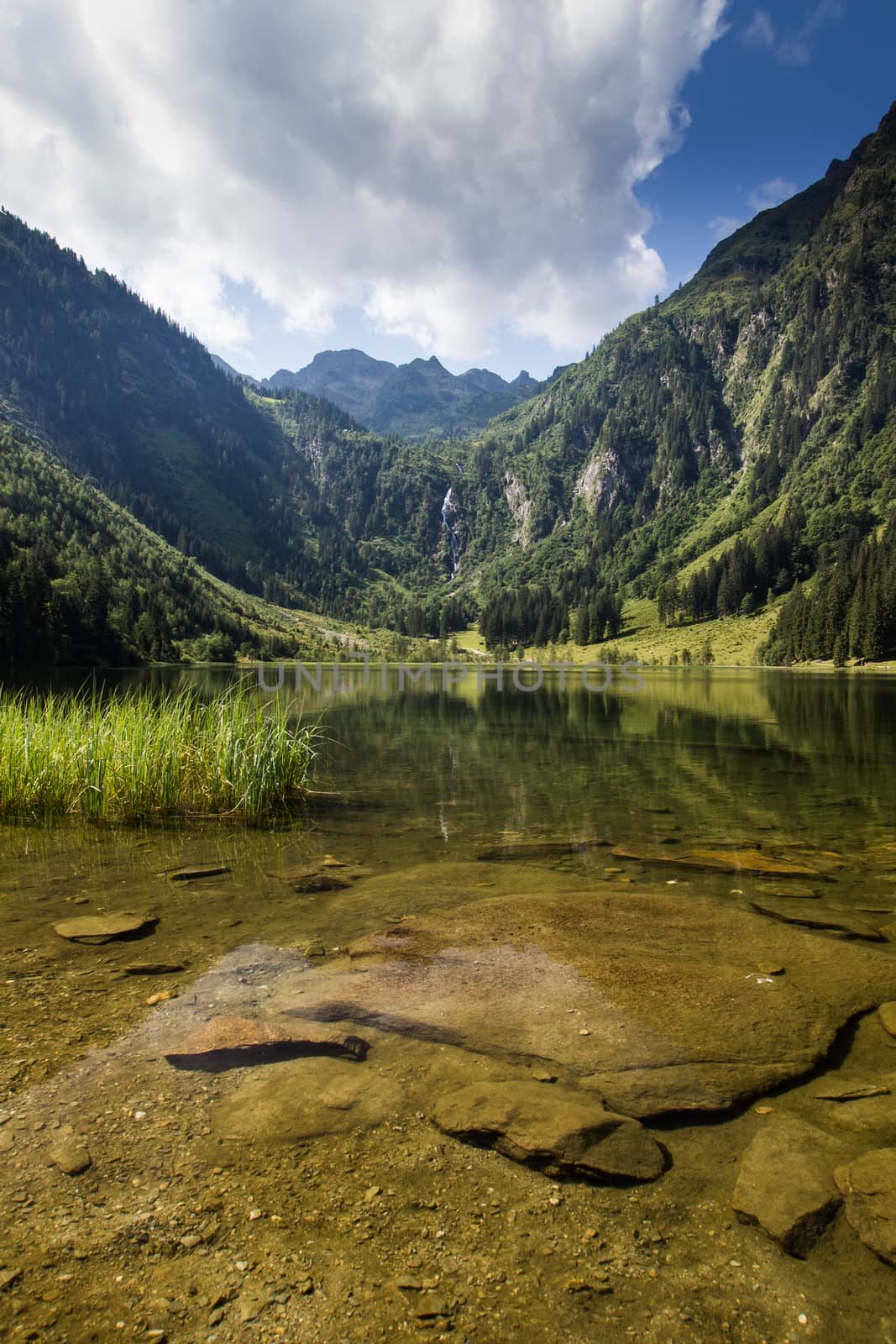 Lake and mountains view in high Alps