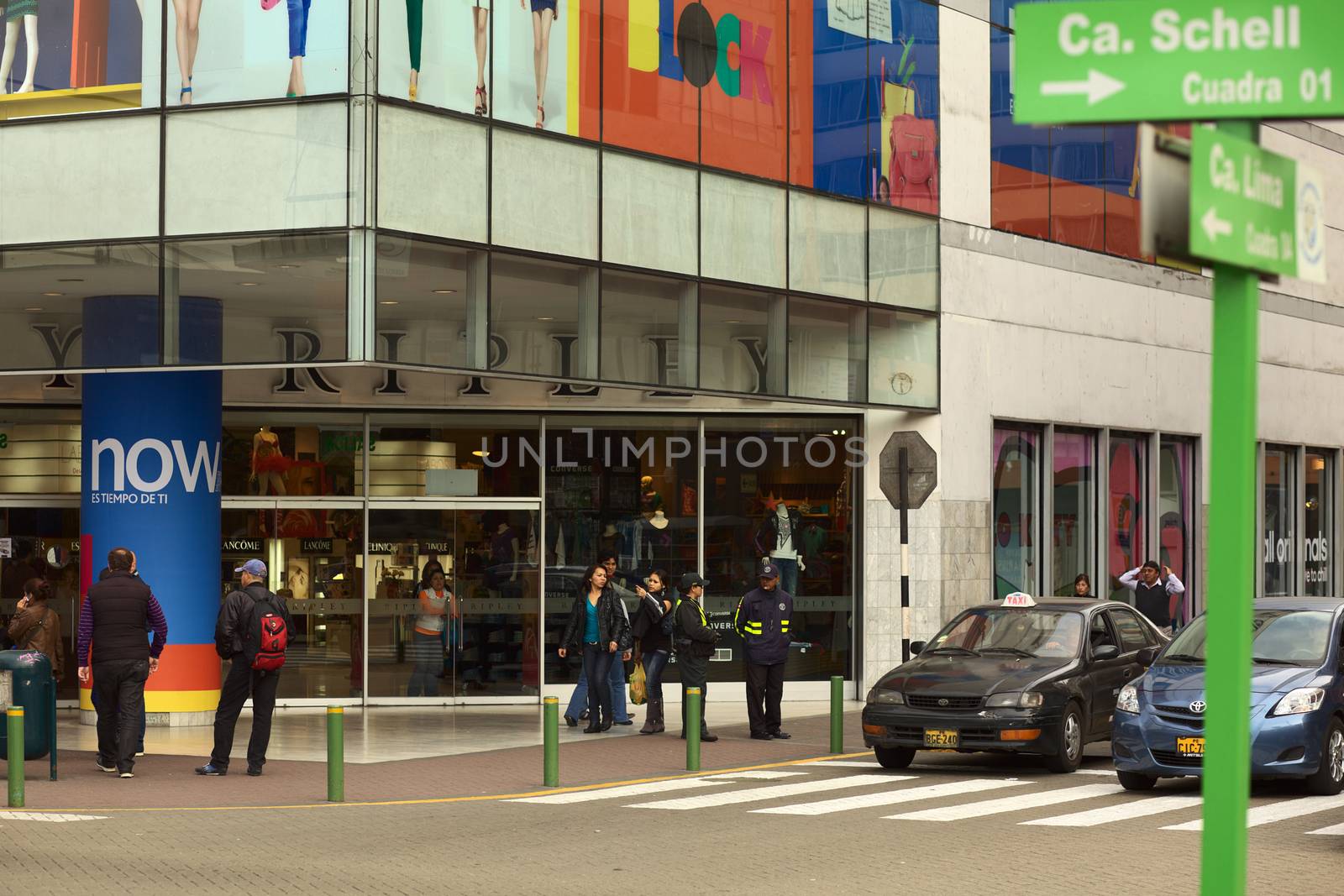 LIMA, PERU - SEPTEMBER 25, 2011: Unidentified people at the entrance of the Ripley department store on September 25, 2011 on the corner of Pje. Los Pinos and Calle Schell in the district of Miraflores, Lima, Peru 