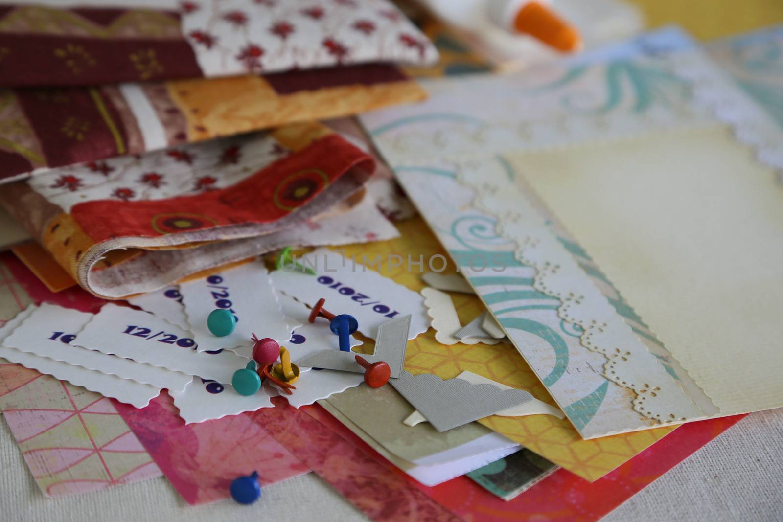 Scrapbooking supplies and accessories for preparing a handmade photoalbum