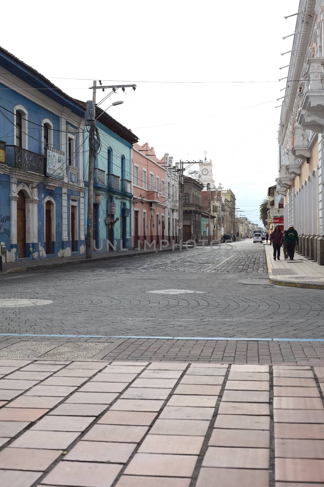 RIOBAMBA, ECUADOR - FEBRUARY 16, 2014: Unidentified people on the street Calle Jose Veloz as seen from the cathedral on February 16, 2014 in Riobamba, Ecuador  