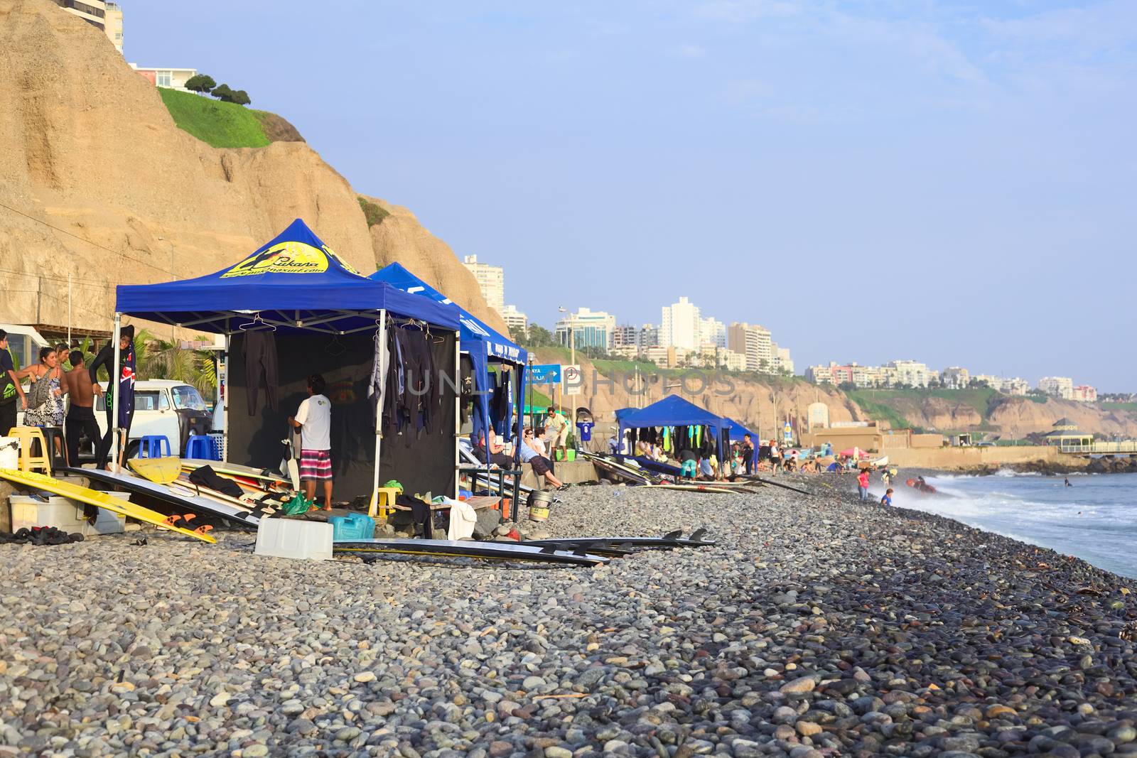 LIMA, MIRAFLORES - APRIL 2, 2012: Unidentified people at surf school stands on April 2, 2012 on the coast of Miraflores, Lima, Peru. Surfing is a popular sport along Lima's coast.