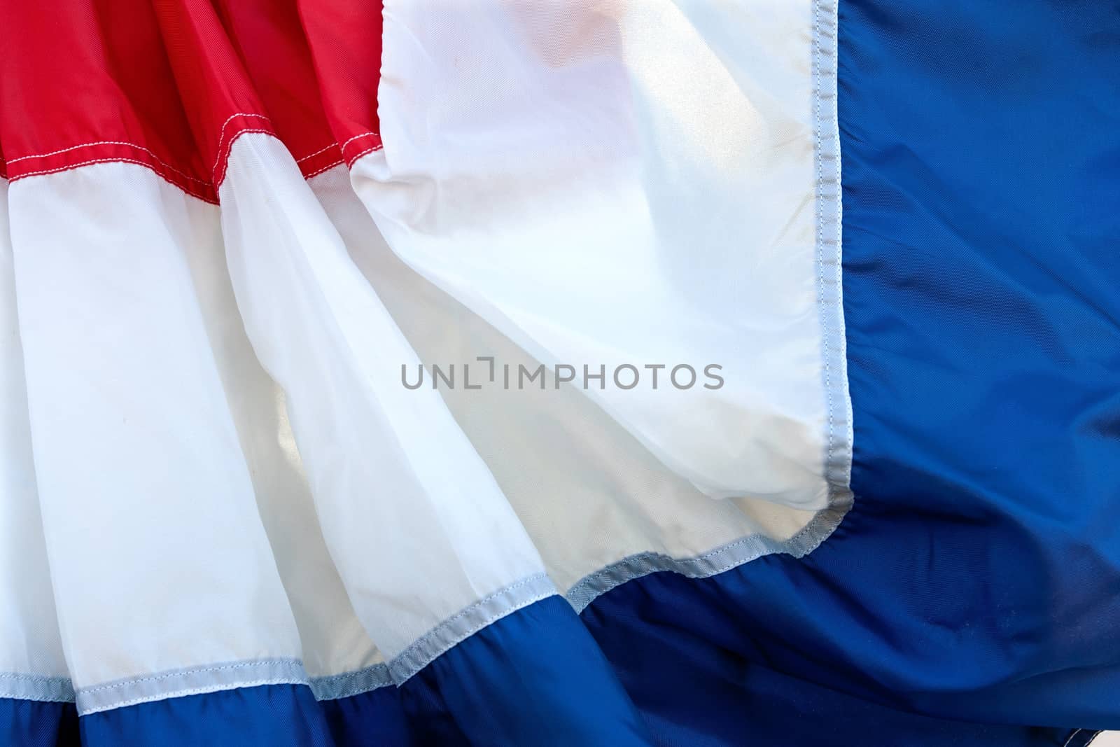 Fabric of red, white, and blue banner fills the frame