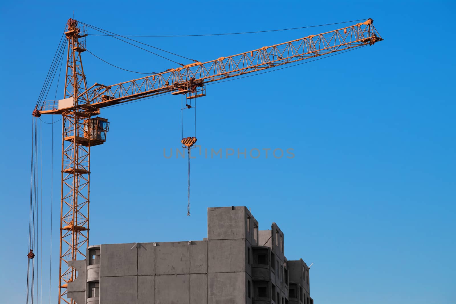 crane and building under construction on the skyline