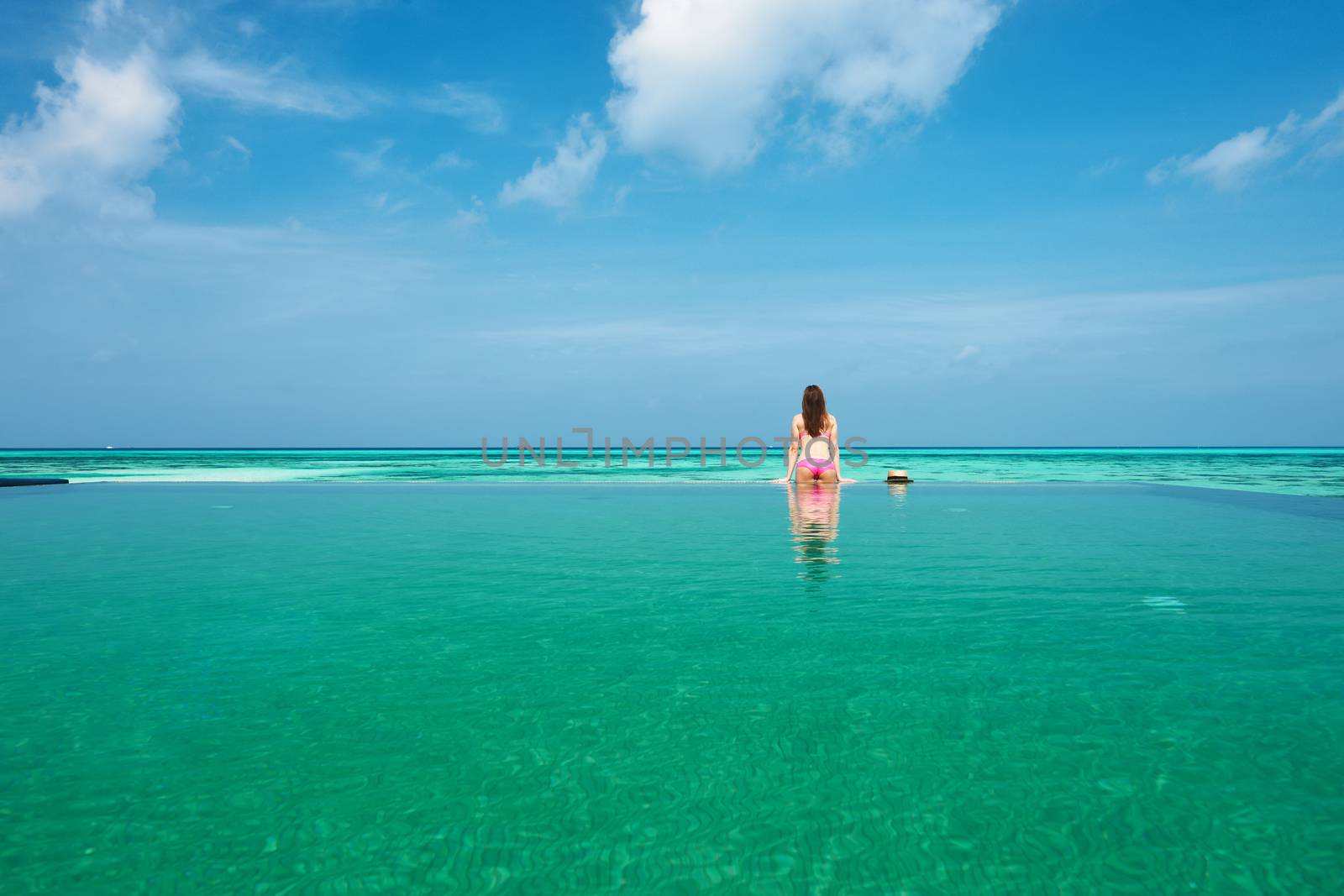 Woman at poolside by haveseen