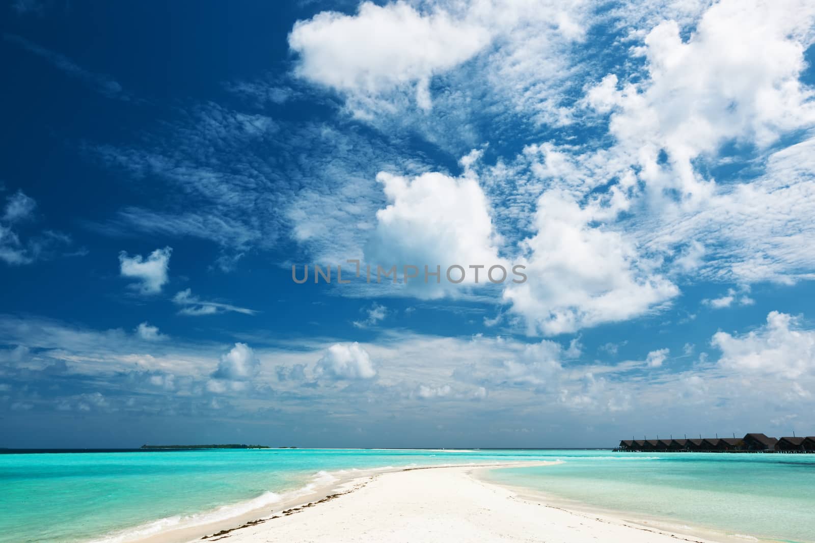 Beautiful island beach with sandspit at Maldives