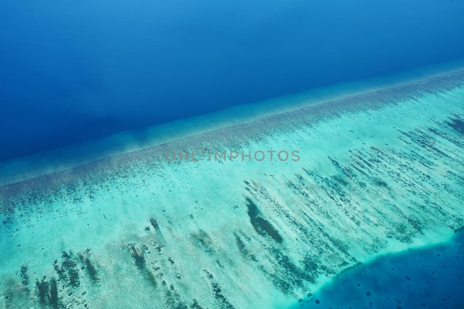 Group of atolls and islands in Maldives from aerial view