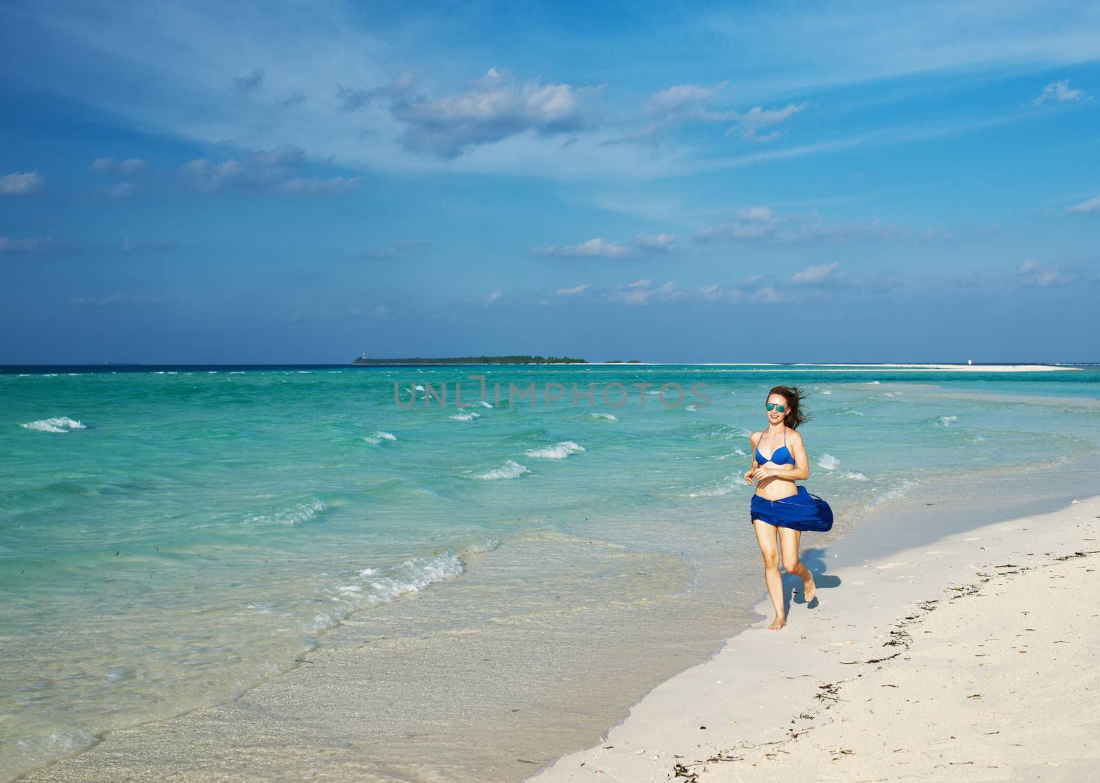 Woman in bikini at tropical beach