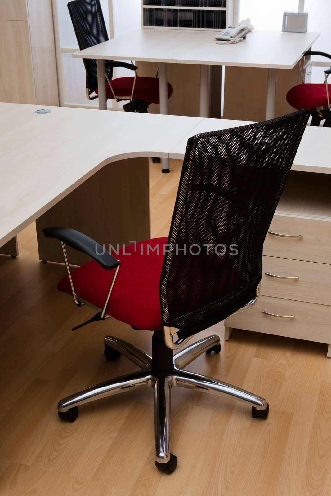 new red chair in a modern office