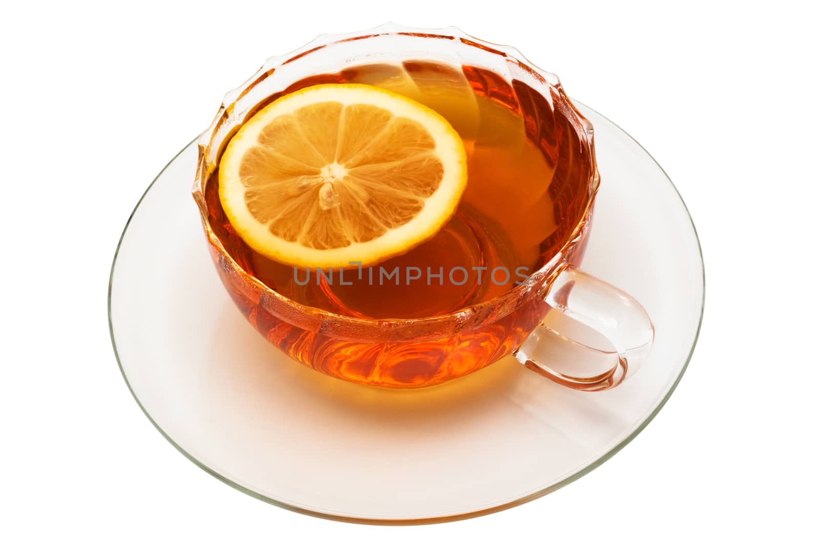 glass cup with tea and a lemon on a white background