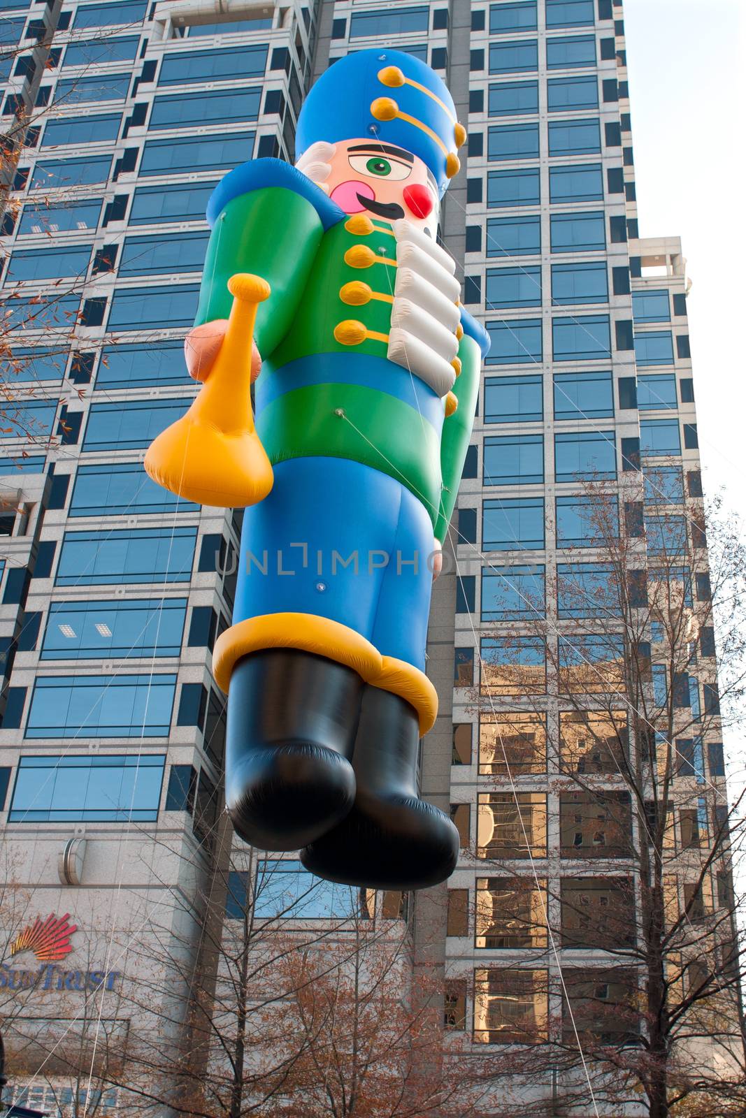 Atlanta, GA, USA - December 1, 2012:  A huge inflated toy soldier balloon moves through the parde route at the annual Atlanta Christmas parade in downtown Atlanta.