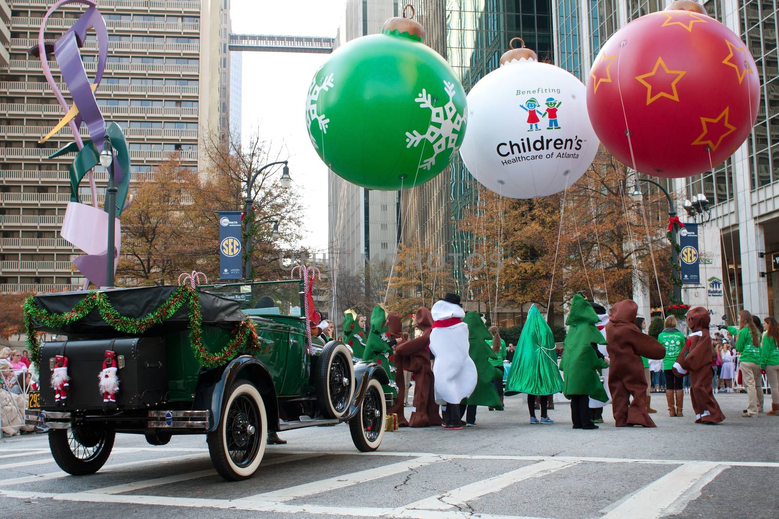 Atlanta, GA, USA - December 1, 2012:  People in costumes with floats gather at the start of the annual Atlanta Christmas parade in downtown Atlanta. 