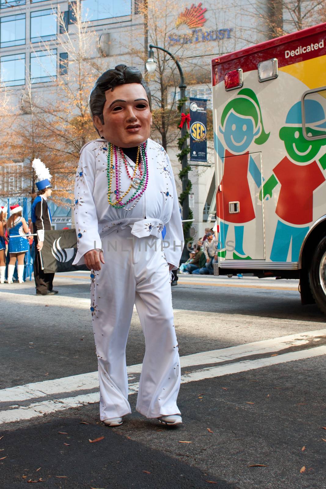 Atlanta, GA, USA - December 1, 2012:  An Elvis "bobblehead" character entertains spectators at the annual Atlanta Christmas parade in downtown Atlanta.