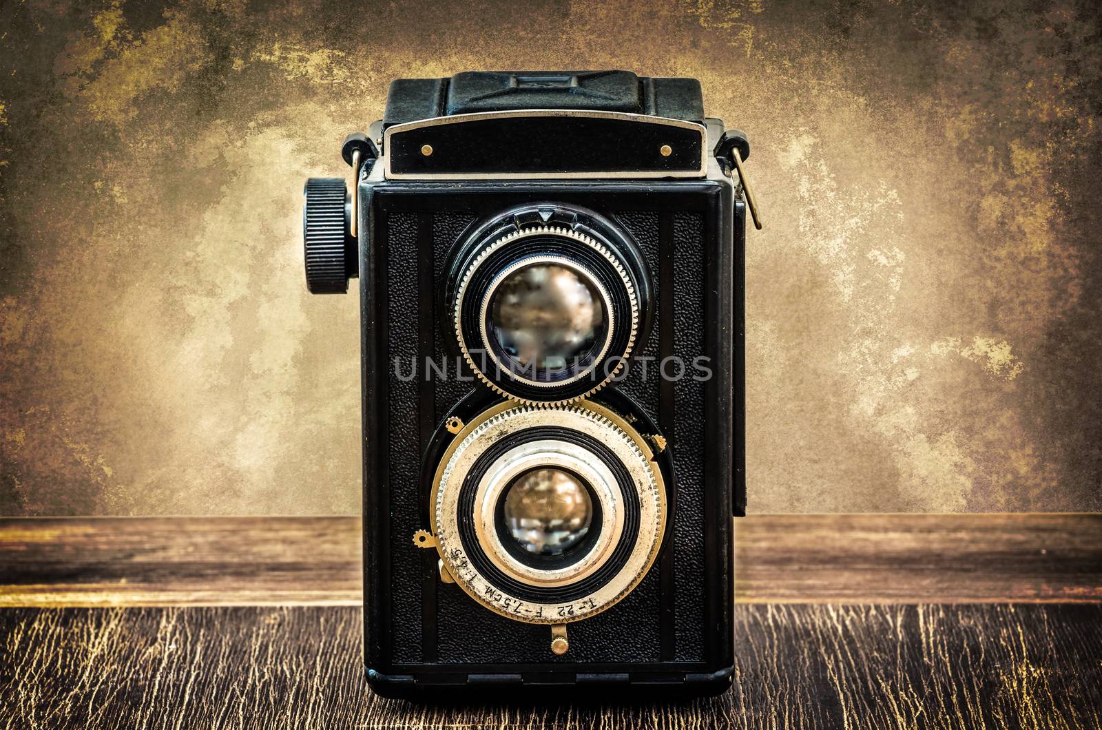 Old fashioned antique camera in vintage style by martinm303