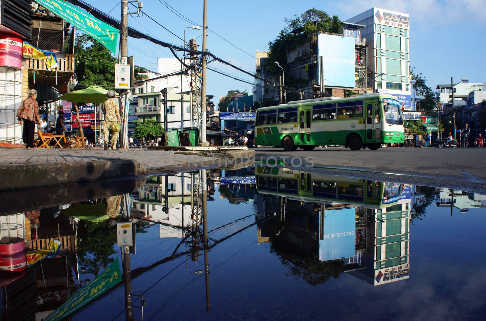 HO CHI MINH, VIET NAM- OCTOBER 20: Cityscape reflect on water in morning, Sai Gon, VietNam, October 20, 2013