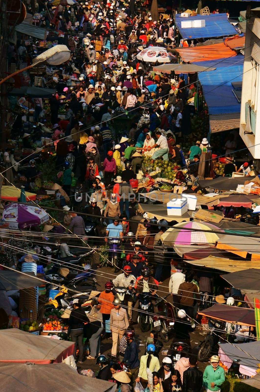 DA LAT, VIET NAM- FEB 8: Crowded, busy scene 's market with crowd of people go to markets to buy goods repair for Tet (Lunar New Year) in Da Lat, Viet Nam on February 8, 2013