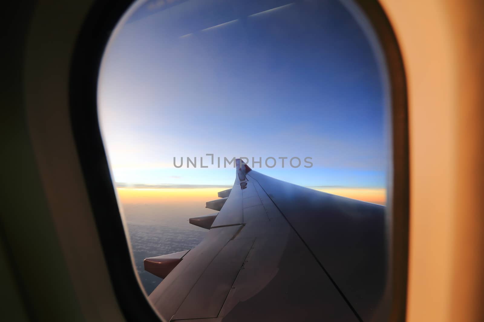 Window airplane Travel time is sunset. by rufous