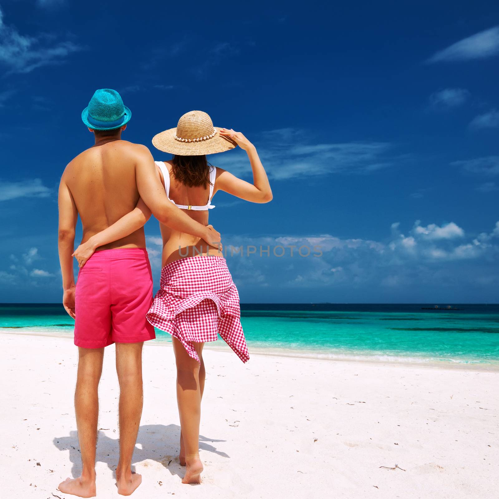 Couple in blue on a beach at Maldives by haveseen