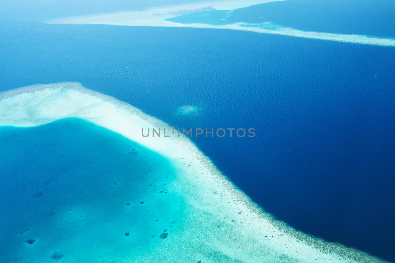 Atolls and islands in Maldives from aerial view by haveseen
