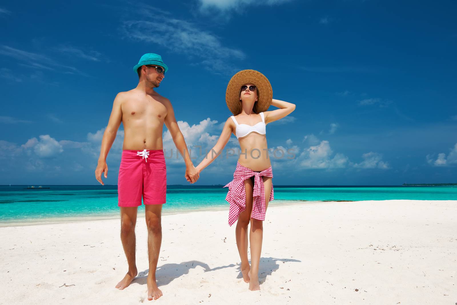 Couple in blue on a beach at Maldives by haveseen