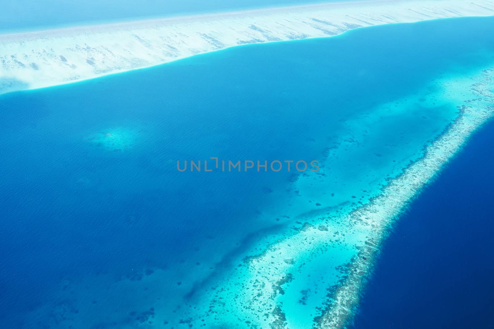 Group of atolls and islands in Maldives from aerial view