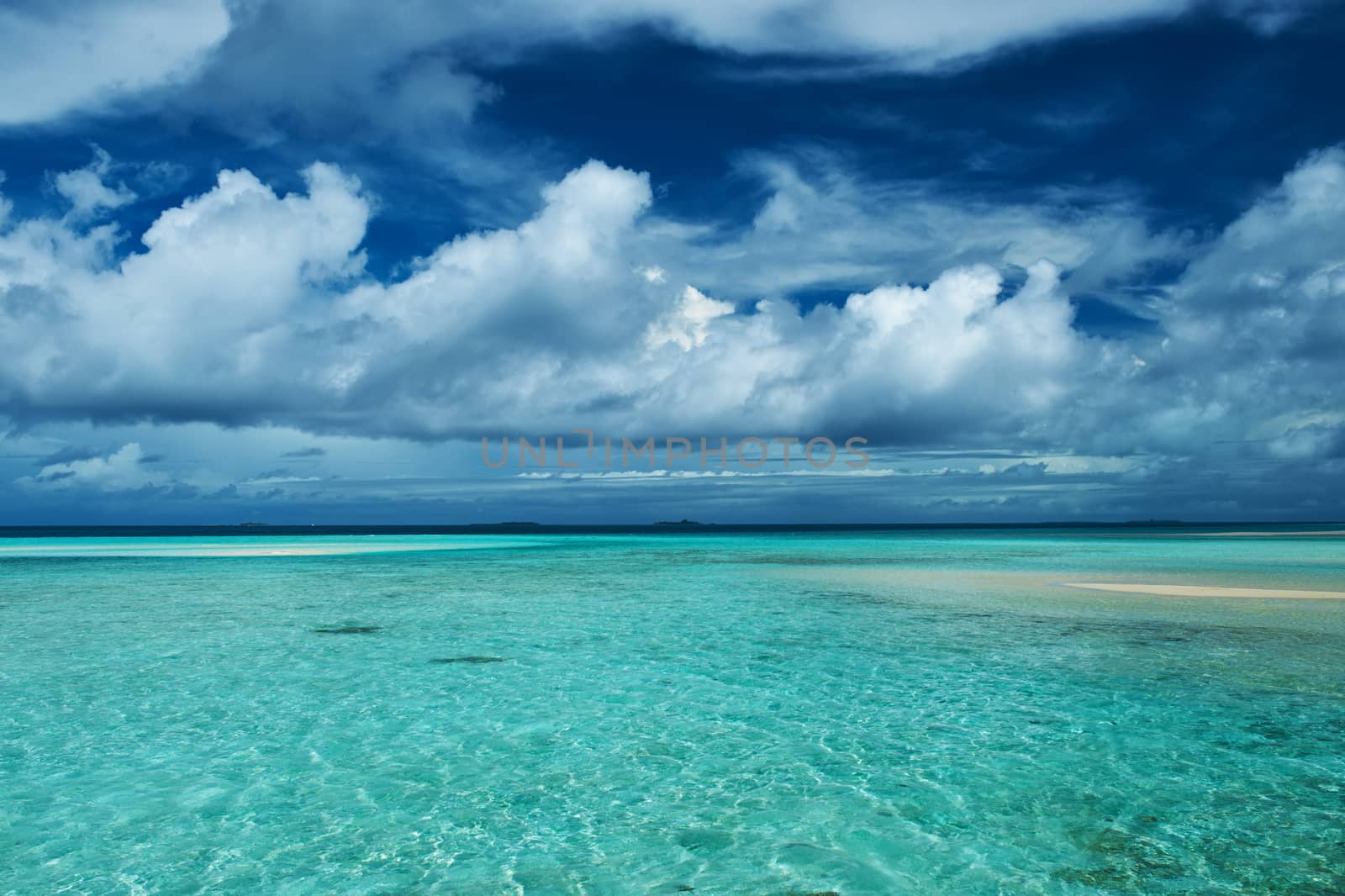 Beautiful island beach with sandspit at Maldives