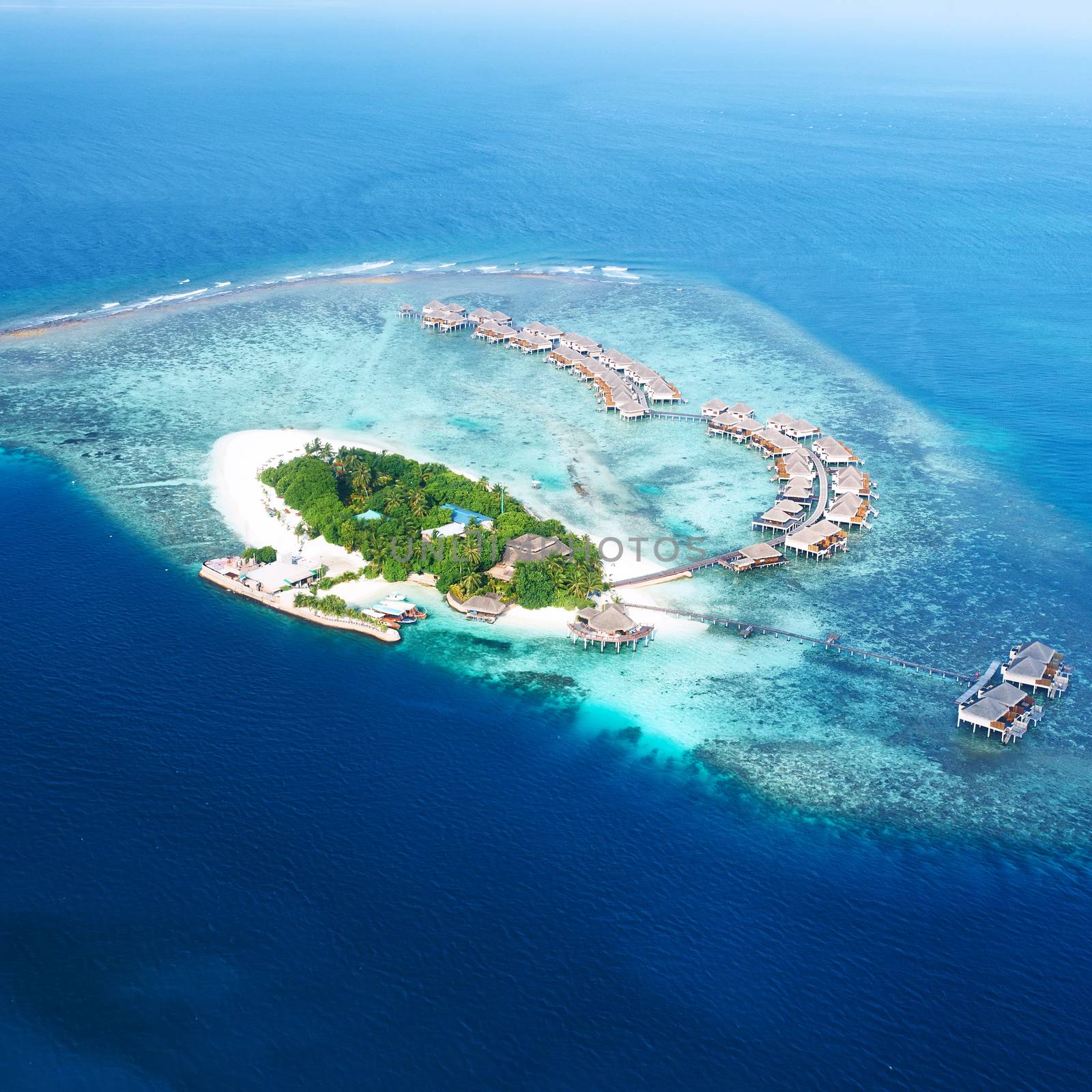 Atolls and islands in Maldives from aerial view by haveseen