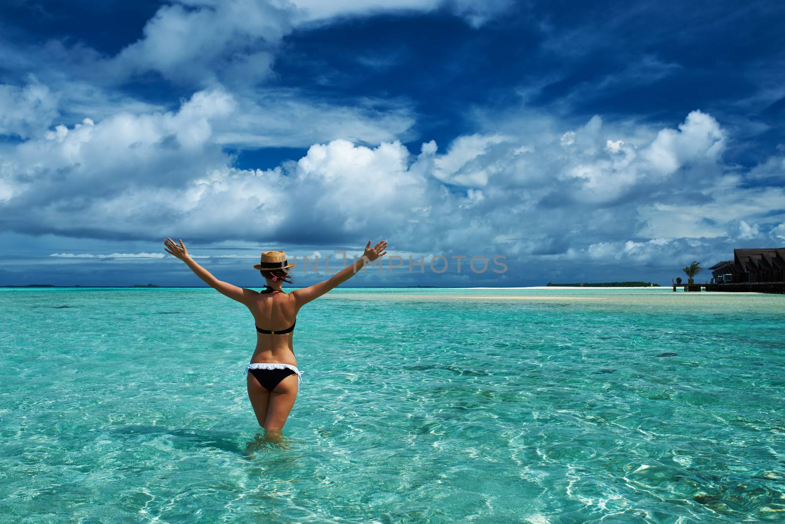 Woman in bikini at tropical beach