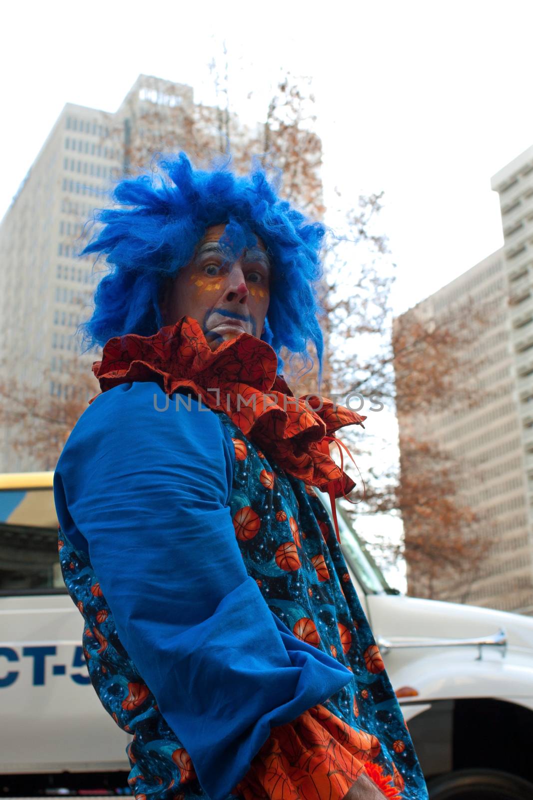 Atlanta, GA, USA - December 1, 2012:  A clown mugs for the camera as he performs at the annual Atlanta Christmas parade in downtown Atlanta.