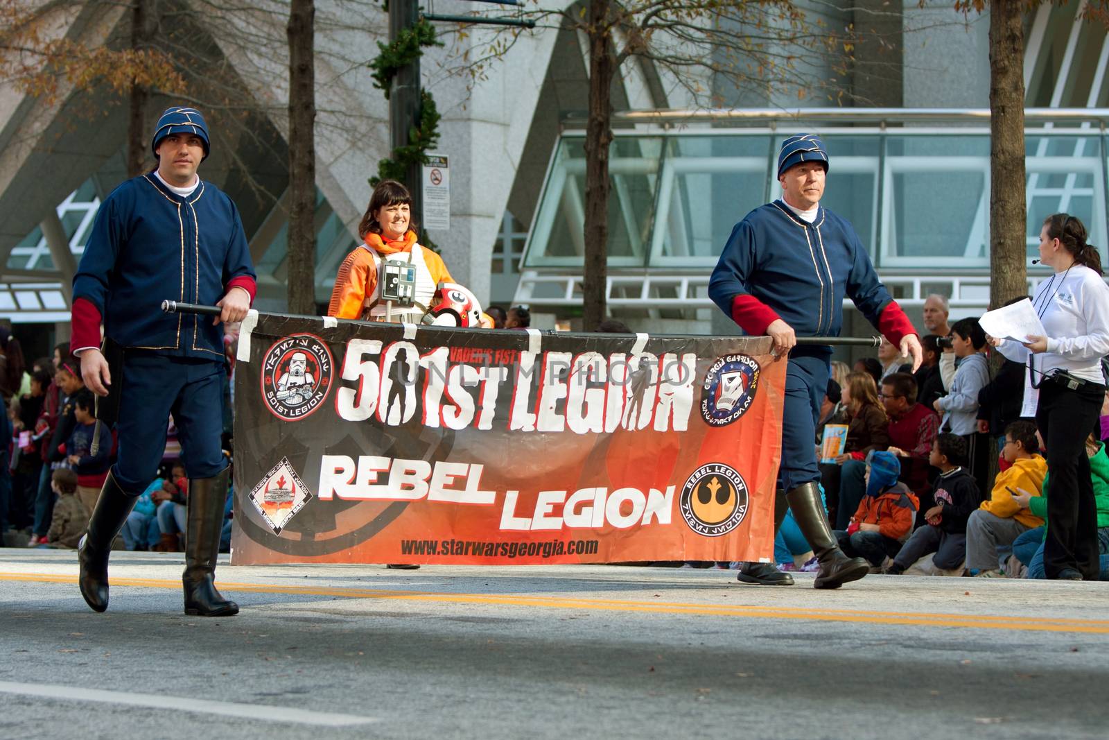 Atlanta, GA, USA - December 1, 2012:  Members of the 501st Rebel Legion carry banner ahead of Star Wars characters taking part in the annual Atlanta Christmas parade in downtown Atlanta.