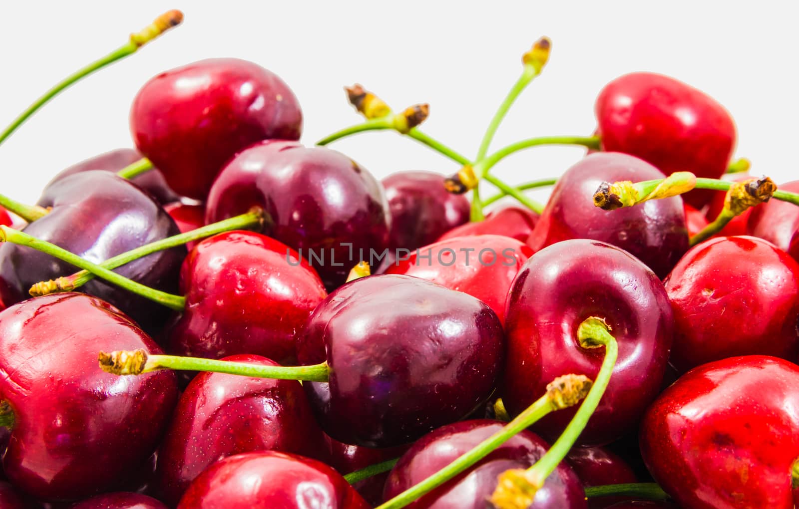 Wallpaper of fresh ripe red cherries.