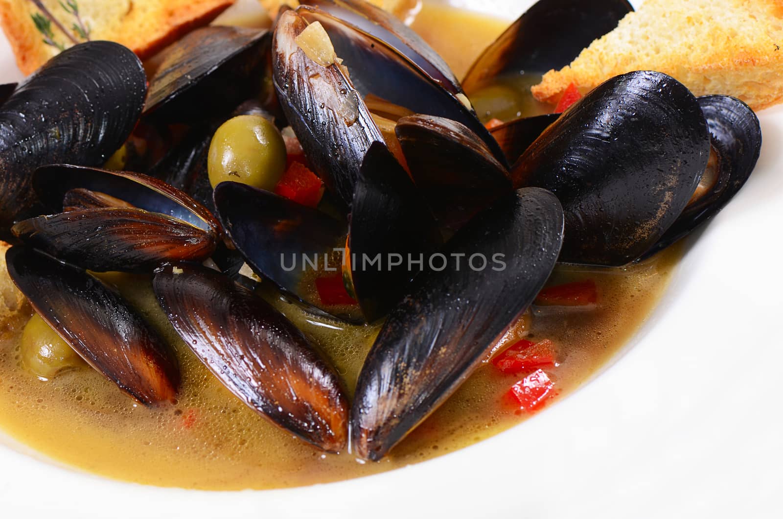 Mussels Tuscan with crispy ciabatta  cloce up