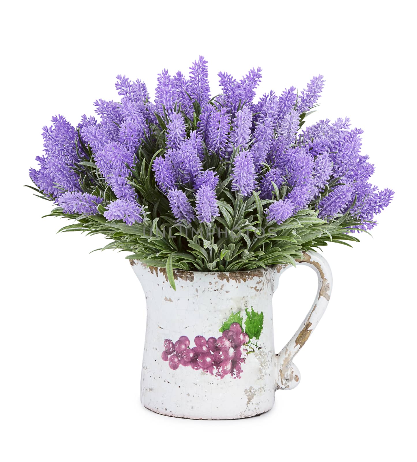 Jug with wild flowers isolated on white