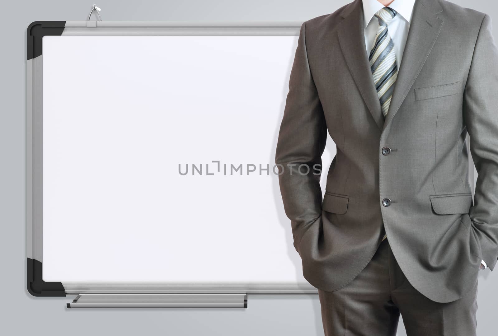 Man in suit and office board. Gray background