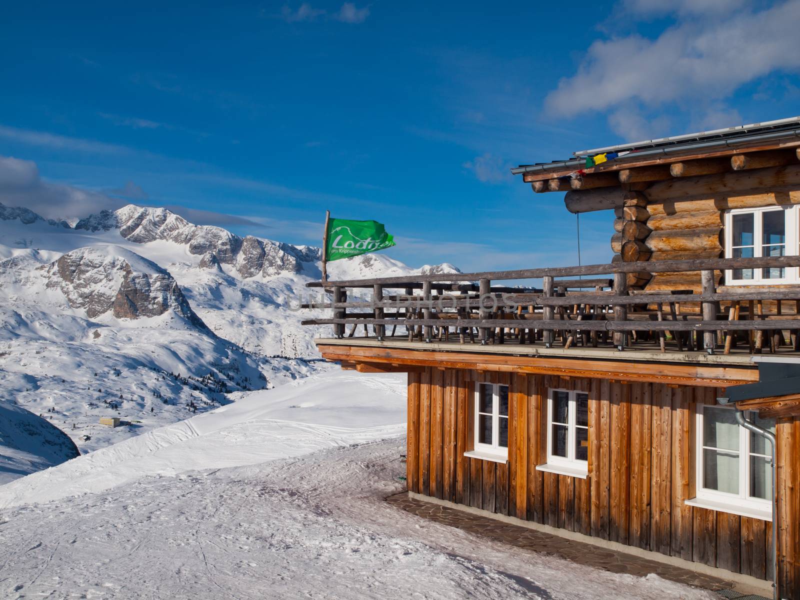 Mountain hut with terrace in winter time by pyty