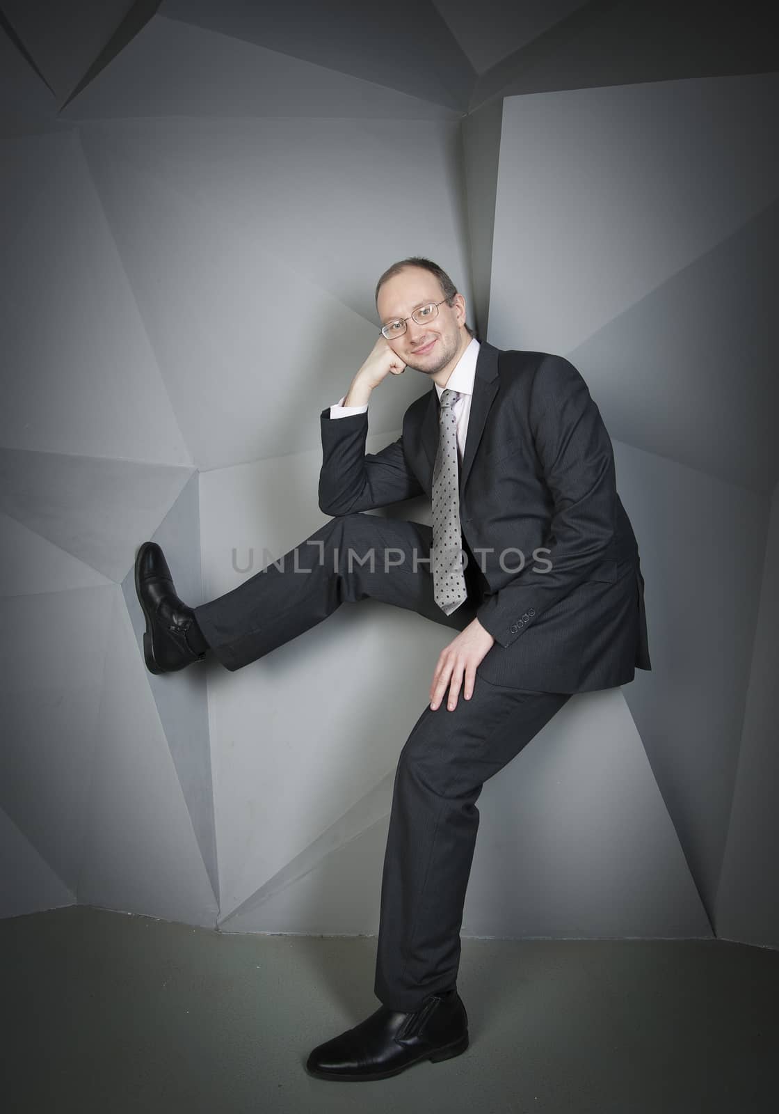  man in a suit and tie on the geometric background